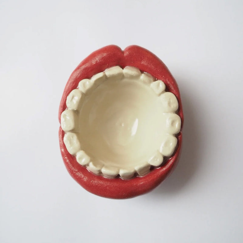 Open the egg cup/bowl with the mouth open